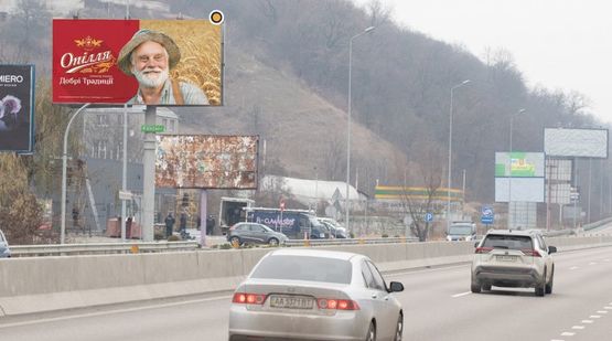 Фото рекламної площини за адресою Днепровское шоссе, в Киев из  Обухова, перед выездом с парковки м-на"ФОРА", за поворотом на Лесники