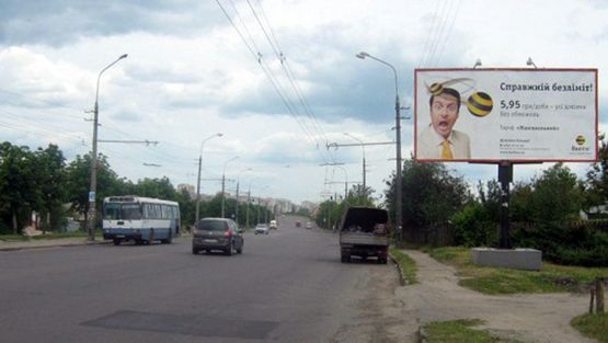 Фото рекламной плоскости по адресу Князя Владимира пр. / Проточный пер., не доезжая до Шевченка пл., возле р. Протока