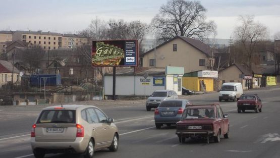 Фото рекламной плоскости по адресу Гостомельское шоссе, выезд с г. Ирпень, за мостом реки "Ирпень", напротив заправки
