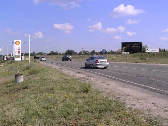 Фото рекламной плоскости по адресу Новокаховское шоссе, трасса М-14, запроавка Шелл стА.
