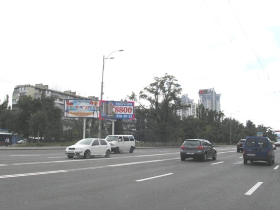 Фото рекламної площини за адресою Воссоединения просп. (ул. Серафимовича, 9), вещевой рынок, маг. "Мобидик"
