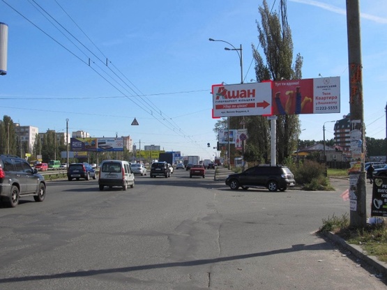 Фото рекламной плоскости по адресу Кольцевая дорога - поворот к ТЦ "АШАН" (магазин "Технополис", в направлении Софиевской Борщаговки)