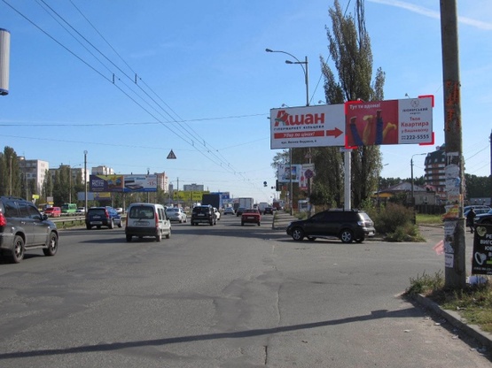Фото рекламной плоскости по адресу Кольцевая дорога - поворот к ТЦ "АШАН" (магазин "Технополис", в направлении Софиевской Борщаговки)