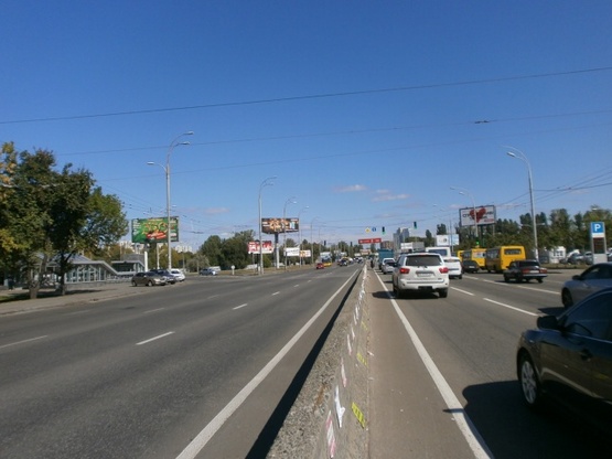 Фото рекламной плоскости по адресу Проспект Глушкова ст. М "Ипподром"(Выезд с ул. В. Касьяна на проспект Глушкова, направление на пл. Московскую)