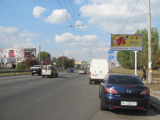 Фото рекламной плоскости по адресу Зодчих ул.,62, Кольцевая дорога (Ашан, АТБ, Новая Почта, Автоцентр, Эльдорадо)