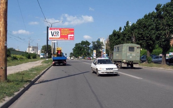 Фото рекламної площини за адресою Павлова Ак. ул., 120/4, (АЗС "Shell", маркет "ЕРА", Трактирь "Артель", СТО, Автотехцентр,дом электроники "Target"), направл. Окружной дороги