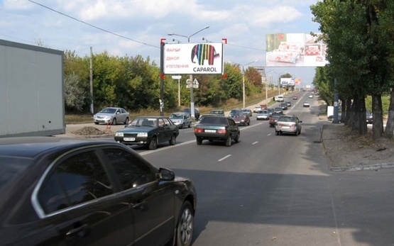 Фото рекламной плоскости по адресу Павлова Ак. ул. - Якутская ул., (ТЦ "Барабашово", шиномонтаж, 300м. к ст. м .Академика Барабашова, Дисконт-Центр Adidas/Reebok), направл. из центра