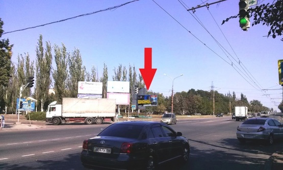 Фото рекламной плоскости по адресу ул. Электрическая/Кремлевская., район КРЭС, (тур-агенство "Мира-Тур", ПриватБанк, "Товары для дома", "Версаль", серв.центр "Киевстар"), в сторону выезда из города