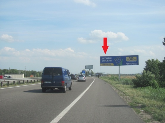 Фото рекламной плоскости по адресу Новообуховская трасса (Днепропетровское шоссе), в направлении из г. Киев, 300 м.. после ТЦ"Мегамаркет", "Мануфактура" ,600 м. ЖК Новая Конча Заспа,  левая