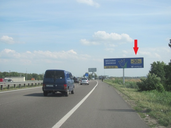 Фото рекламной плоскости по адресу Новообуховская трасса (Днепропетровское шоссе), в направлении из г. Киев, 300 м.. после ТЦ"Мегамаркет", "Мануфактура" ,600 м. ЖК Новая Конча Заспа, правая