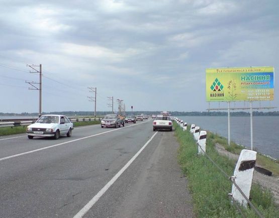 Фото рекламной плоскости по адресу Черк.дамба ( выезд), изгиб