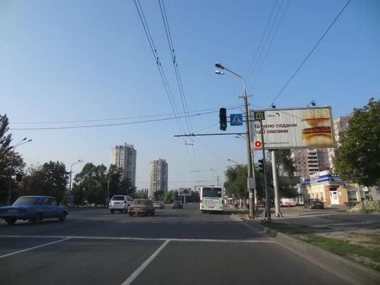 Фото рекламной плоскости по адресу Набережная Победы ул., 100 - Победы пл., из центра