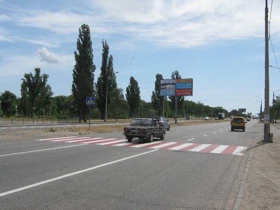 Фото рекламної площини за адресою Набережна магістраль  – каскад «Радуга», напр. руху до вокзалу (призматрон)
