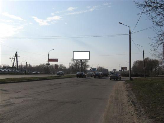 Фото рекламной плоскости по адресу Набережна магістраль  – вул.Фортечна, (гаражі), напр. руху до порту(призматрон)