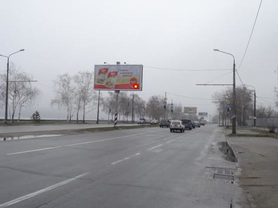 Фото рекламной плоскости по адресу Набережна магістраль  – вул.Немировича-Данченка, "Рибацький стан", напр руху до порту (призматрон)