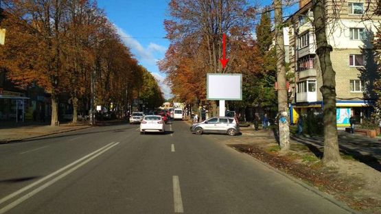 Фото рекламної площини за адресою t034A,вул. Титова, біля ТРЦ "Аполло", навпроти піццерії "Челентано"