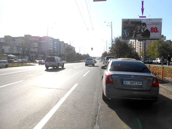 Фото рекламной плоскости по адресу вул. Драйзера, 9 у напрямку ринку "Троєщина"