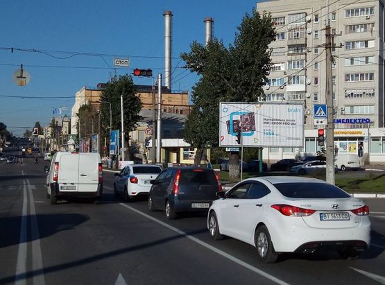 Фото рекламной плоскости по адресу просп. Свободы (ул.60л.Октября), перекр. с ул. Чкалова, возле Электростанции, напротив автошколы «СИЮЖ», самая крупная транспортная развязка