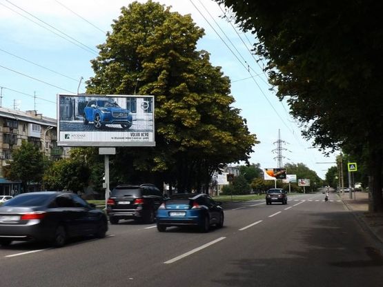Фото рекламной плоскости по адресу пр.О.Поля (Автодорожний технікум), маг.Юність/пр.Кирова (Автодорожный техникум) маг.Юность центр города, супермаркеты