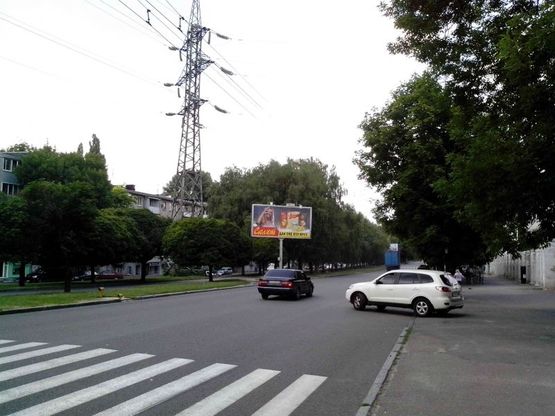 Фото рекламной плоскости по адресу пр.О.Поля, 103/пр.Кирова, 103, остановка комбинат игрушек, перед перекрестком с пр.Ильича, поток к пр.Пушкина