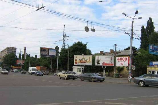 Фото рекламной плоскости по адресу 1-я ст. Люстдорфской дор. -маг. "Монарх" (левая) (Призма)