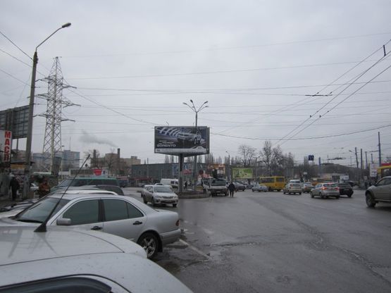Фото рекламной плоскости по адресу просп. Маршала Жукова - ул. 25-й Чапаевской дивизии (призма на треугольнике)