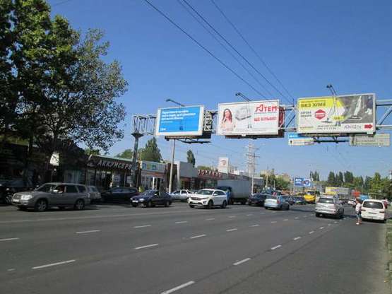 Фото рекламной плоскости по адресу пр-т М.Жукова (напротив авторынка "Успех") (в місто центральный Призма)