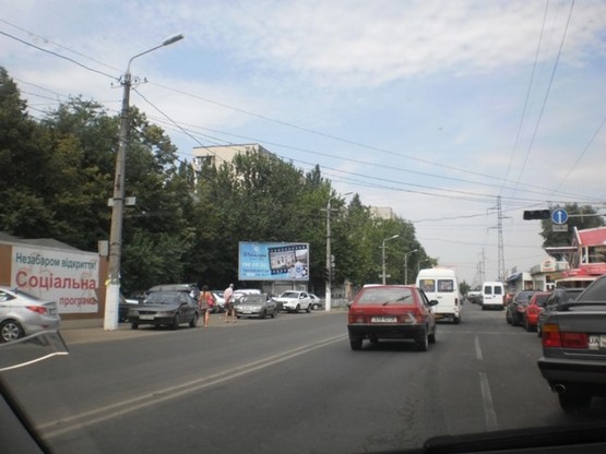 Фото рекламної площини за адресою Малиновского (автостоянка)