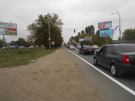 Фото рекламной плоскости по адресу Кольцевая дорога, 400 м до остановки Рынок "Столичный"  (на светофоре)(нижняя пл.)