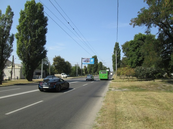 Фото рекламної площини за адресою Героев Сталинграда просп., 70, (магазин "Стройматериалы", автосервис АИС), в направл. ул. Морозова