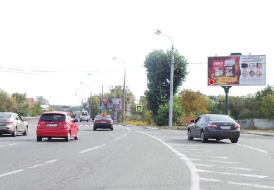 Фото рекламної площини за адресою Столичное шоссе, выезд из Киева на Конча-Заспу