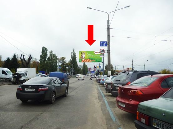 Фото рекламної площини за адресою Павлова ул. / Тюринская ул. (бывш. Якира ул.), флажок, со стороны рынка "Барабашова", в центр