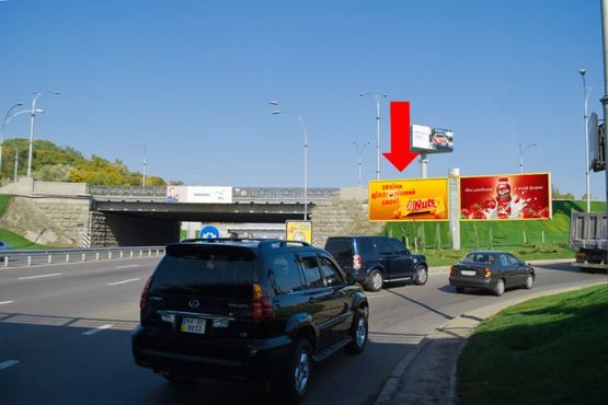 Фото рекламной плоскости по адресу Надднепрянское шоссе / Дружбы народов бул., развязка на мосту Патона, в сторону ст. м. "Днепр" и Воссоединения пр., левый
