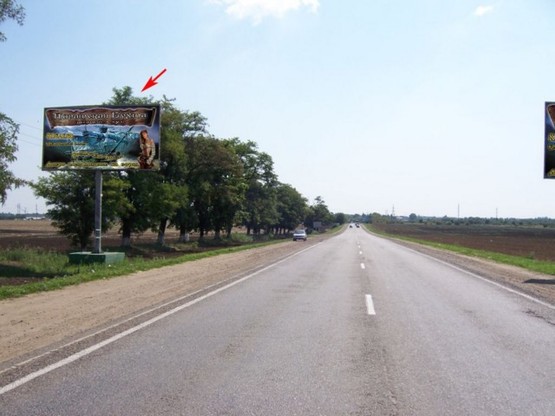 Фото рекламной плоскости по адресу Одесса - Кучурган 12+670 Б деревья