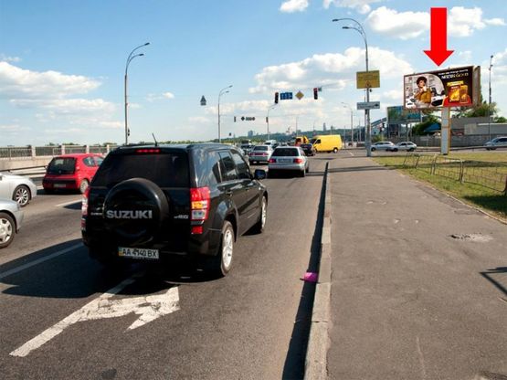 Фото рекламной плоскости по адресу Набережно-Рыбальская ул. / Электриков ул., в сторону мост Гаванский, Подола