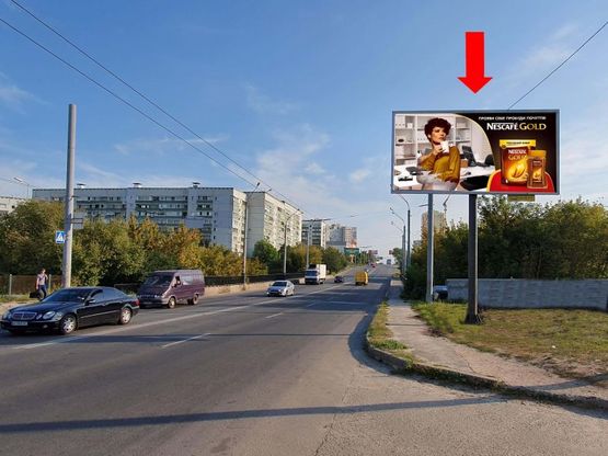 Фото рекламної площини за адресою Гвардейцев Широнинцев ул. - ул. Бучмы, напротив АЗС "Окко", из центра