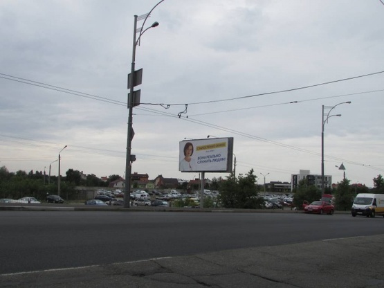 Фото рекламной плоскости по адресу Теодора Драйзера 34-51/ Оноре де Бальзака, (світлофор)