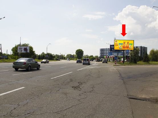 Фото рекламної площини за адресою Столичное шосе / ул. Заболотного, поворот на авторынок, из центра