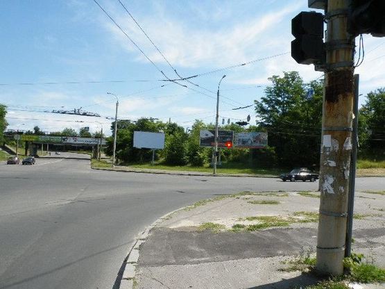 Фото рекламной плоскости по адресу Одесская ул / Сумгаитская ул, со стороны ЗТА, в центр