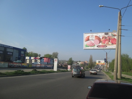 Фото рекламної площини за адресою Павлова Ак. ул., 120/4, (АЗС "Shell", маркет "ЕРА", Трактирь "Артель", СТО, Автотехцентр,дом электроники "Target"), направл. Московского просп., призма