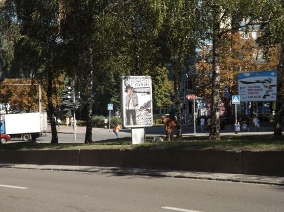 Фото рекламной плоскости по адресу пр.О.Поля, 12/пр. Кирова, 12