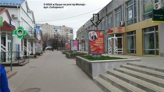 Фото рекламної площини за адресою на розі проспектів Молоді та Соборності. (територія ТЦ "Гостинець", квітникового ринку)