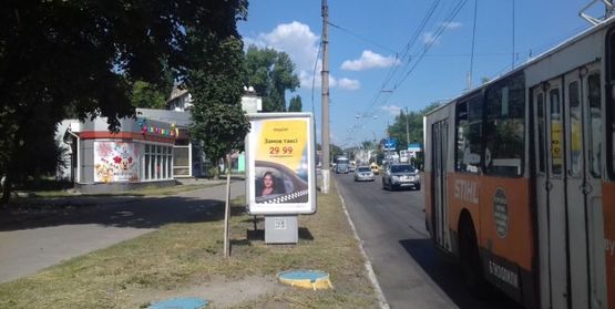 Фото рекламной плоскости по адресу ул. Первомайская, район д. №57 (2) (в сторону ЖД вокзала)