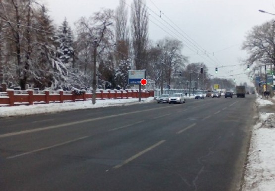 Фото рекламной плоскости по адресу Юрия Ильенка ул., 48 (Мельникова ул.) (напротив)