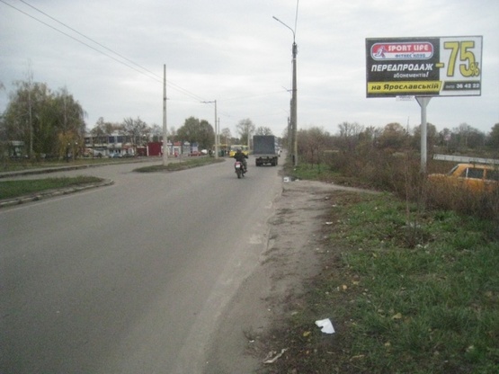 Фото рекламной плоскости по адресу Оноприенка ул., напротив дома №2 (Пожарная академия, маркет "АТБ", АЗС "Лукойл", магазины быт.техники), направл. в центр
