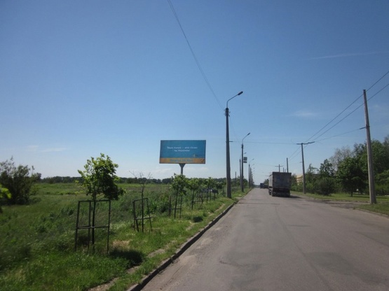 Фото рекламной плоскости по адресу Оноприенка ул., напротив дома №2 (Пожарная академия, маркет "АТБ", АЗС "Лукойл", магазины быт.техники), направл. из центра