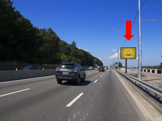 Фото рекламной плоскости по адресу Набережное шоссе ул., 1100 м. от ст.м. "Днепр", в сторону Подола