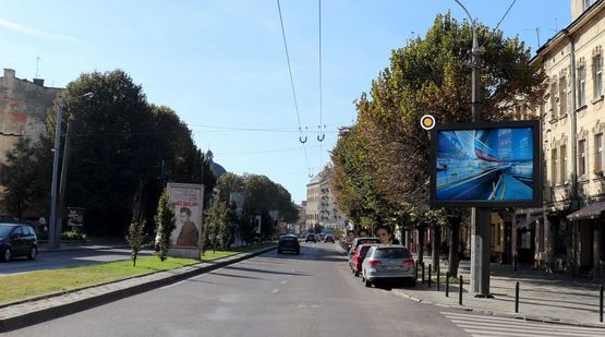 Фото рекламной плоскости по адресу Черновола В. Пр. / Медовая ул., в центр, к ТЦ Магнус и Национальному оперному театру