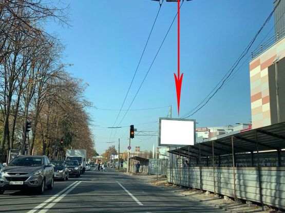 Фото рекламной плоскости по адресу s059A6,вул. Титова, 32А, біля ТЦ АПОЛЛО, рух у бік вул. Макарова, на світлофорі