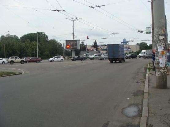 Фото рекламной плоскости по адресу пл.Зыгина (на треугольнике) с ул.Октябрьская